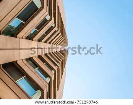 Abstract image of glass and concrete building. Architectural exterior facade and detail. Abstract color background. Modern architecture and design. 