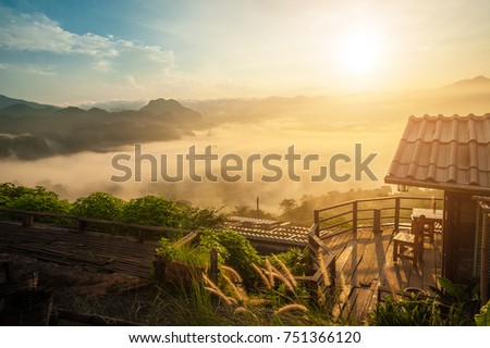 Little Home at Phu Langka National Park, Phayao Province, Thailand
Golden sunrise above the high mountain foggy valley with old wooden houses on a hill.