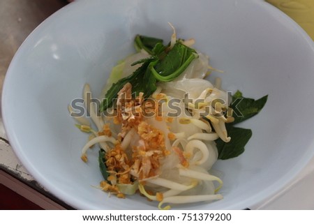 Thai chicken stew soup noodle dish is usually seasoned with chili powder to enhance flavor. Vegetables are part of main ingredient for Thai noodles too.

