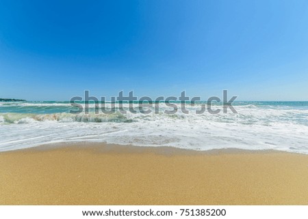Sea waves and sand beach for texture or background. The flow of water