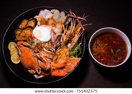 The noodles mix seafood pork & egg with Tomyum Stock