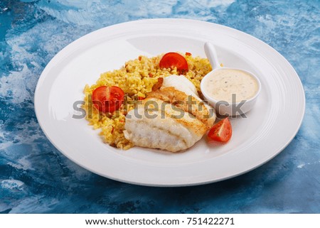Fried pike perch fillet and bulgur. Fried fish dinner. Healthy eating