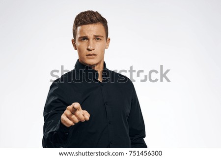 business man showing his finger in the camera                               