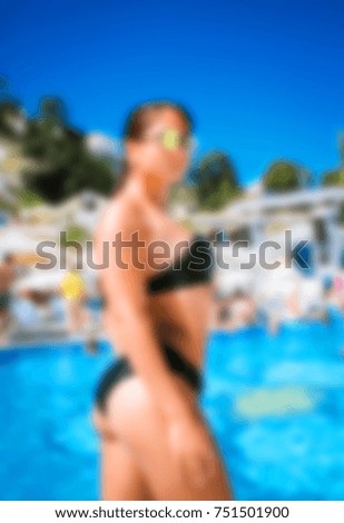 Blurred for background. beach resort. Men and woman relaxing in luxury beach resorts during summer holidays. boy and girl has rest on day lounge party at pool club