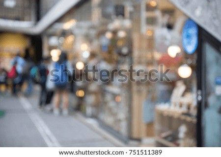 Abstract blurred people  at street market with colorful bokeh use for holiday shopping background
