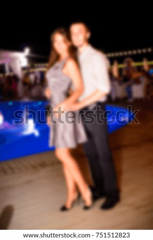 Blurred for background. night club. People during concert in night club party. Man and woman at club. Boy and girl at night club party. Wedding party.