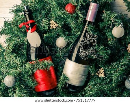 Photo of spruce branches with two bottles of wine, blank greeting card