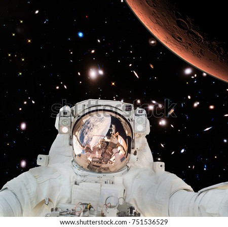 Closeup of astronaut. Deep space, mars on the backdrop. The elements of this image furnished by NASA.