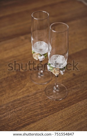 Patterned glasses for wine cocktails are on the wooden table.