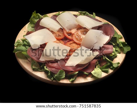 bresaola with tomatoes, parmesan cheese and salad