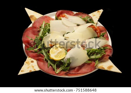 bresaola with parmesan cheese and rocket salad