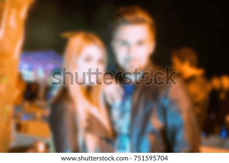 Bluured for background. People during concert in night club party. Man and woman at club. Boy and girl at night club party