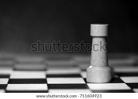 Chess figure on a chessboard. Black and white