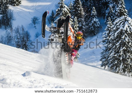 Rider on the snowmobile in the mountains ski resort in Sakhalin island Russia. Royalty-Free Stock Photo #751612873
