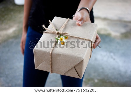 the gift box in hands young lady