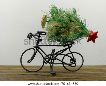 transporting the Christmas tree by bicycle, abstract point of view miniature 