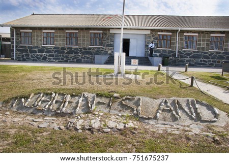 entrance and stone name sign of historical museum prison on robben island