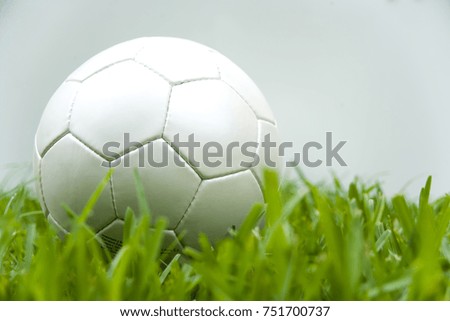 Soccer ball over grass