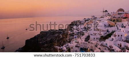 Sunset at the village of Oia Santorini Greece, Beautifull sunset sky at a bright summer evening by Santorini