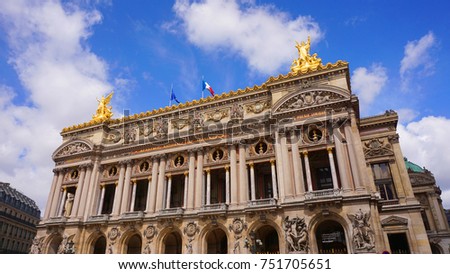 Photo from famous Palais Garnier or Opera in center of Paris with beautiful scattered clouds, France                               