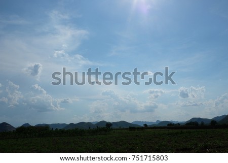 Blue sky and mountain view with rice field on the very hot and sunshine day.