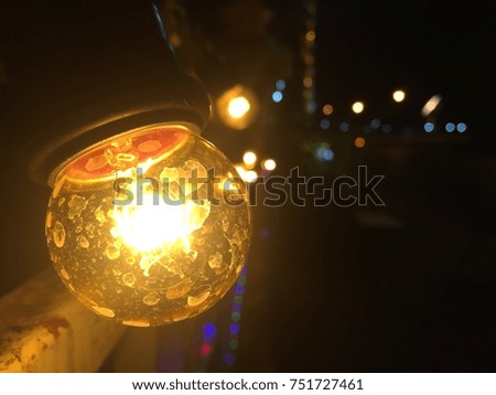 Light bulb on street at night