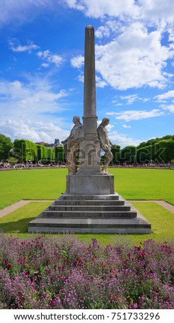 Photo from iconic Luxemburg gardens in center of Paris with beautiful scattered clouds, France                        