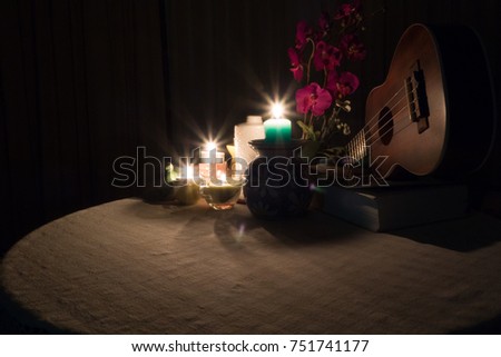 candles light on the table with small vase or jars