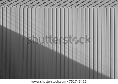 grey corrugated metal wall with shadow