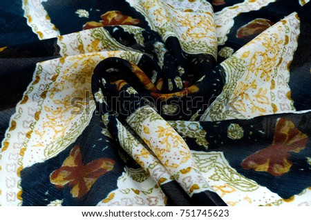 texture, background, pattern. Black silk handkerchief. With white stripes. On the stripes painted butterflies, floral pattern
