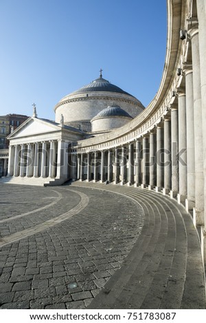 Scenic afternoon view of the curved colonnade architecture of the Basilica Reale Pontificia San Francesco di Paola (built in 1816) in the Piazza del Plebiscito, in Naples, Italy
