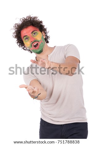 the funny guy applied colorful paint to his face paint while performing magic shows. Isolated on white background.