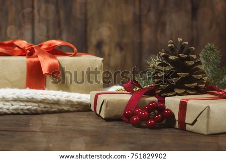 New Year and Christmas concept. Bokeh. Gifts, viburnum, fir cone.