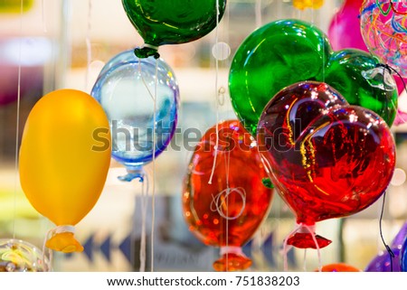 Balloons of Murano glass. Balloons made of Murano glass in the form of hearts. Colorful balloons made of Venetian Murano Glass.