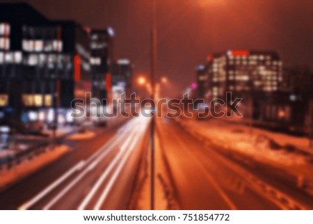 blurred traffic light trails on road at night