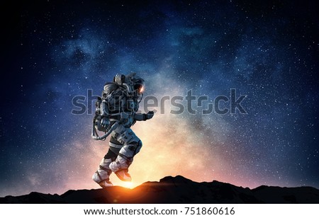 Spaceman running fast. Mixed media Royalty-Free Stock Photo #751860616