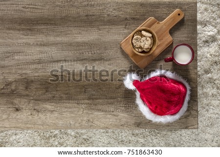 Table background from above. Christmas time and x mas decoration on top of desk. Floor with carpet.