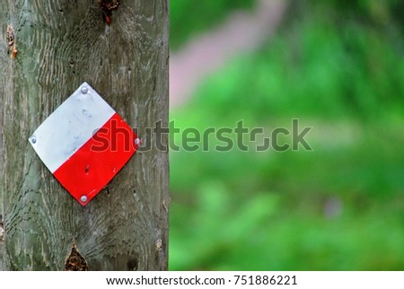 Wooden pole with sign 