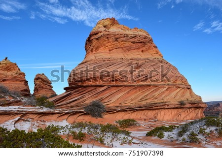 Sandstone buttes with light snow in Airzona desert. Royalty-Free Stock Photo #751907398