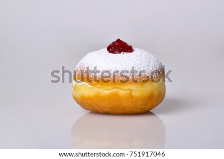 jewish food holiday Hanukkah symbol image of donut with jelly and sugar powder. isolated . DESSERT 