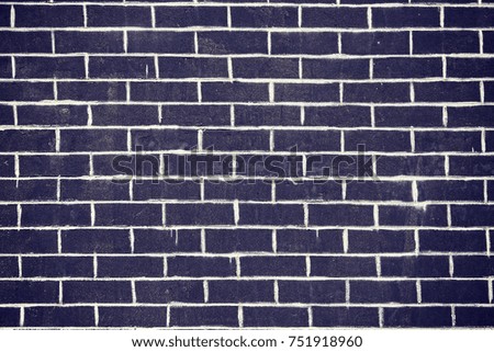 Old dark brick wall texture or background, color toned picture.