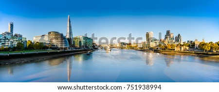 London skyline panorama with reflections viewed from the Tower Bridge