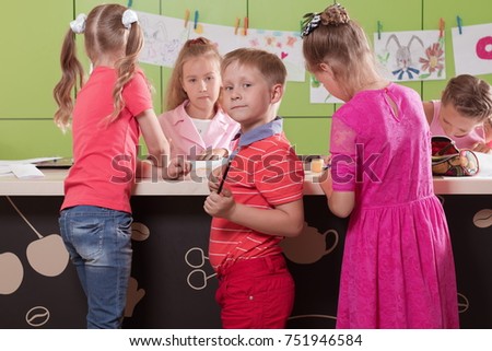 classes in creative children's school, girls and boys posing