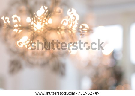 Silhouette of snowflakes on the background of a New Year tree. Christmas background. Blurred image of a decorated interior for Christmas.