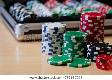 Stack of poker chips with it's container case