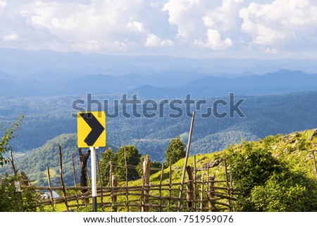 traffic sign, mountain clouds and blue sky