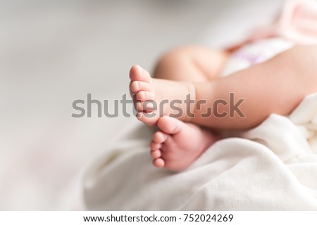 New Born Baby Feet on White Blanket Royalty-Free Stock Photo #752024269