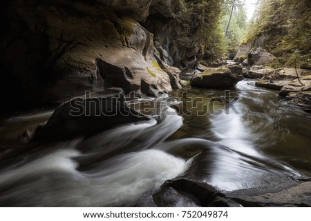 Beautiful natural river flowing into a cave. Taken in Huson Caves, Vancouver Island, British Columbia, Canada.