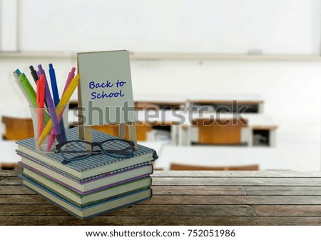 School, literacy and education objects with greeting card in picture frame, eyeglasses, pens over school and education background