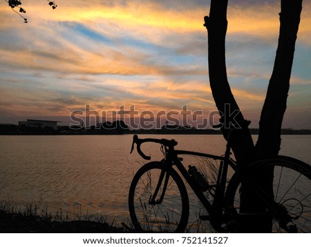 Bicycle near by lake in the evening view.